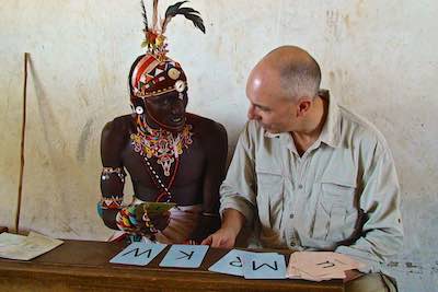 Mark teaching English to Samburu warrior